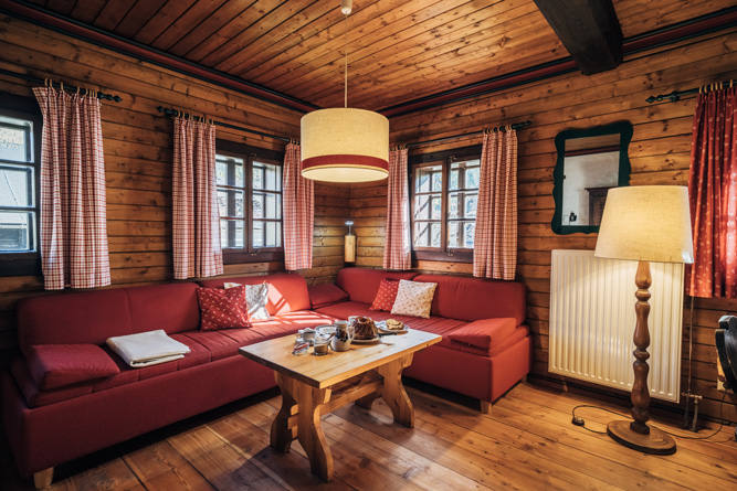 Vacation Apartment Kolmnock Vacation apartments for family vacations in Carinthia, view into the cozy parlor of the vacation apartment in the Slow Travel Resort