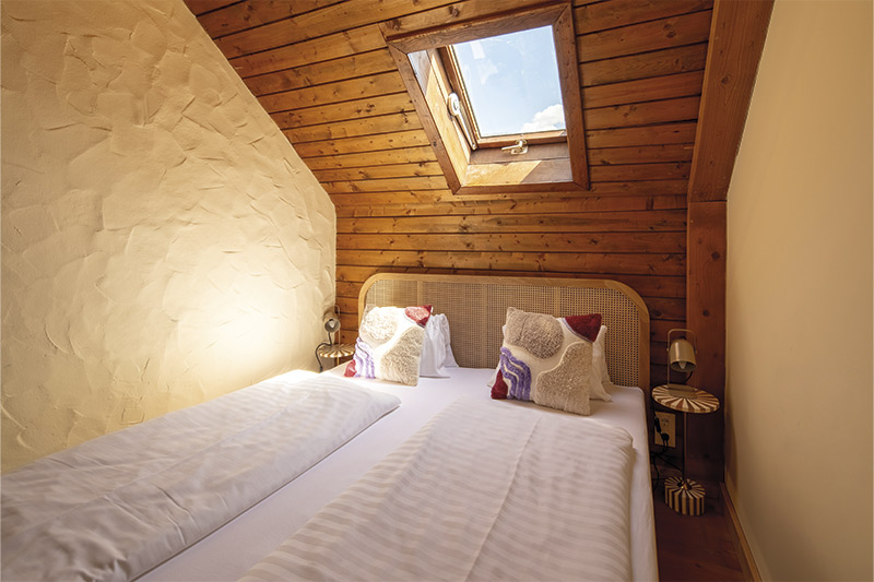 Bedroom Appartement Mirnock Cozy bedroom in Appartement Mirnock in the Slow Travel Resort Kirchleitn in Bad Kleinkirchheim, Carinthia.